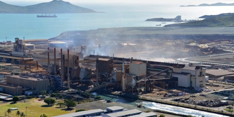 aerial view of city buildings near body of water during daytime