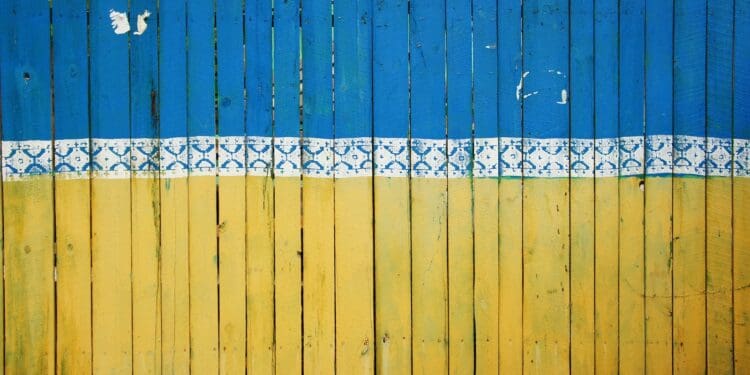 yellow and blue wooden fence