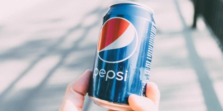 person holding pepsi can