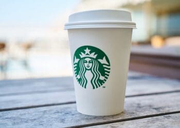 closed white and green starbucks disposable cup