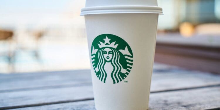 closed white and green starbucks disposable cup