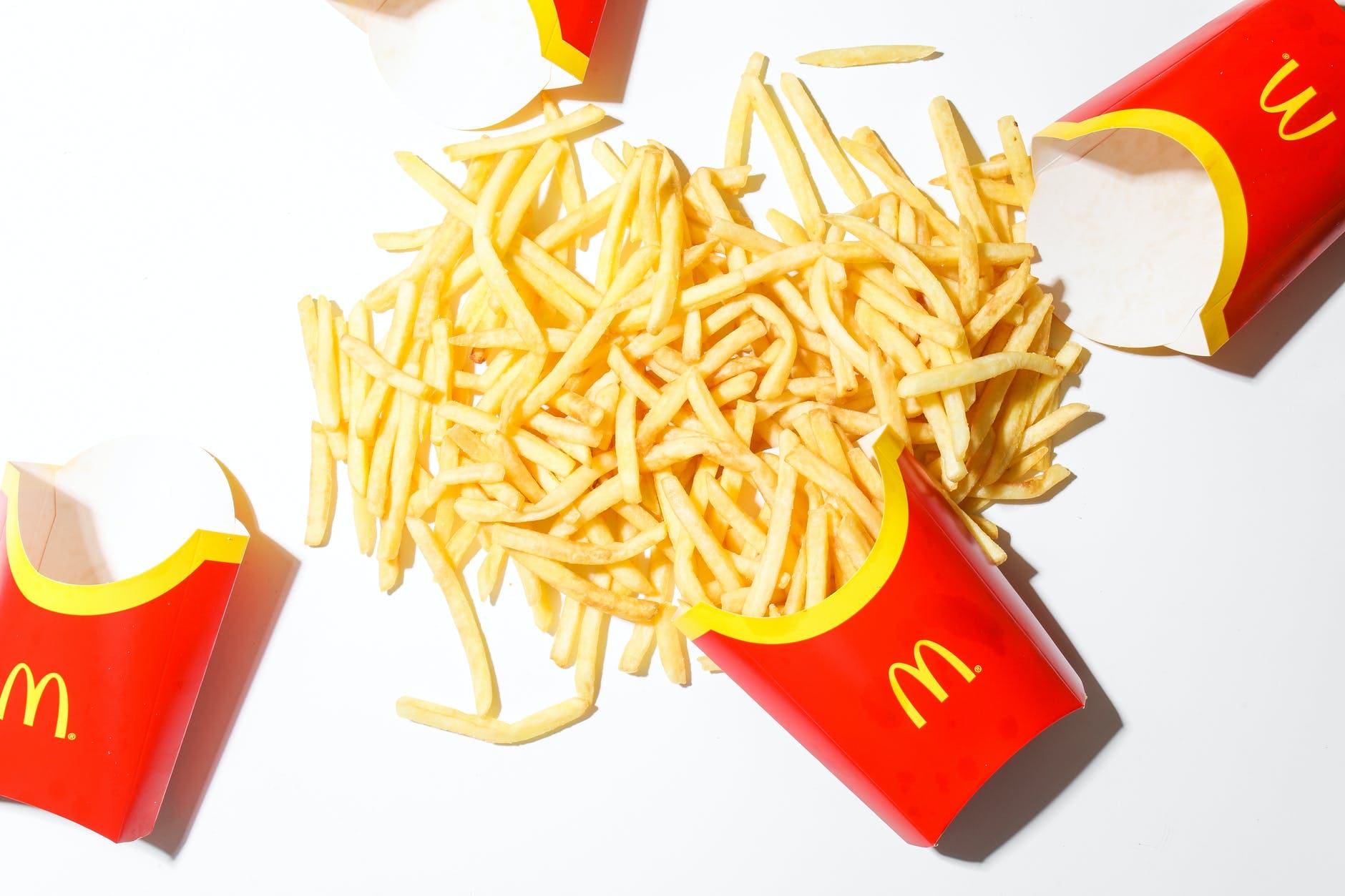 mcdonalds fries on white table