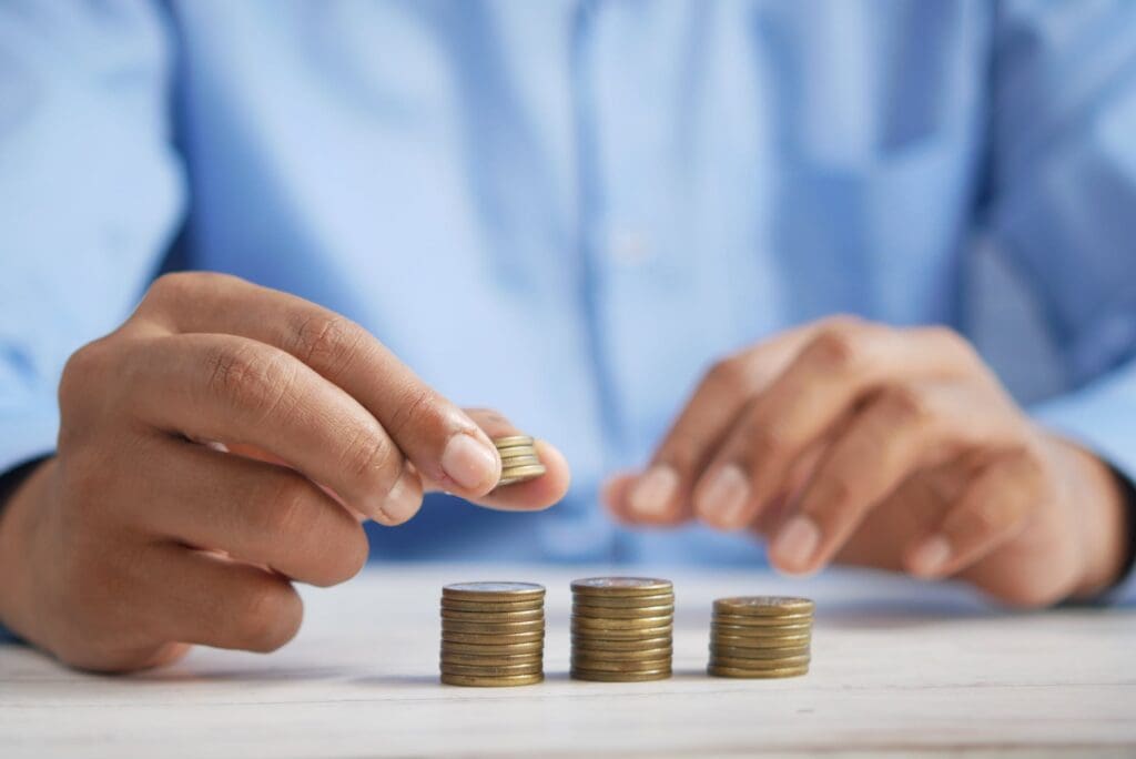 person wearing gold ring holding white textile