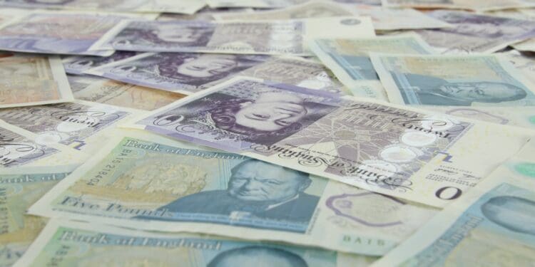 5 pieces of banknotes on yellow and white textile