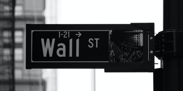 grayscale photo of Wall St. signage