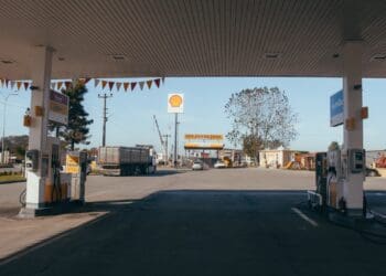 Empty gas station with oil petrol dispensers located on highway for serving long distance vehicles