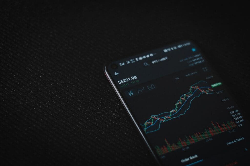 black android smartphone on black textile