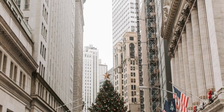 Christmas Tree Near White Concrete Building on Wall Street