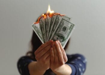 a fan of fake American dollars on fire