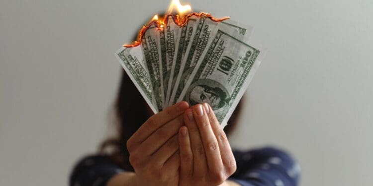 a fan of fake American dollars on fire
