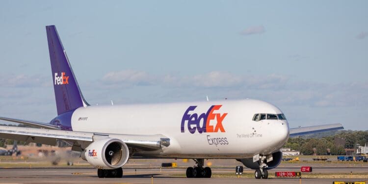 white and red passenger plane on airport during daytime