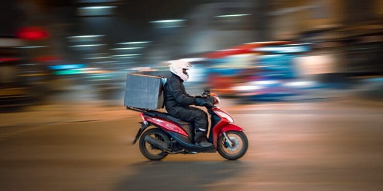 man riding motorcycle on road during daytime