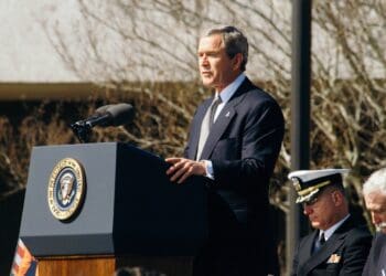 George W. Bush standing on lectern during daytime