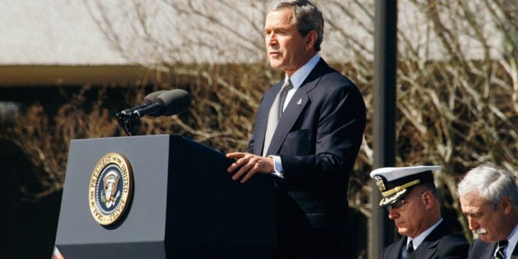 George W. Bush standing on lectern during daytime