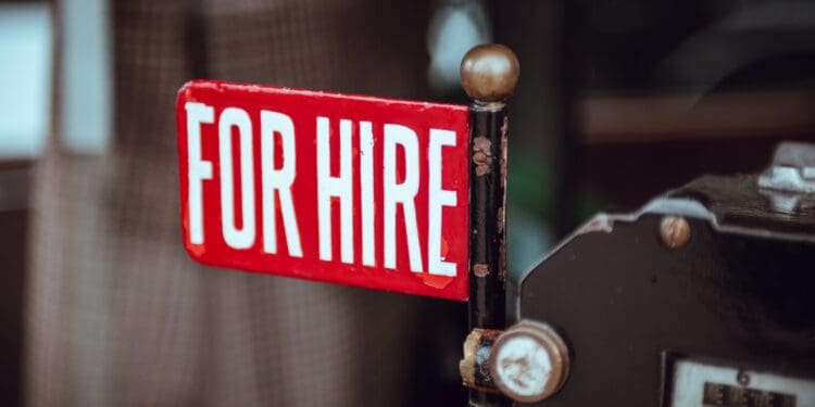 shallow focus photography of red and white for hire signage