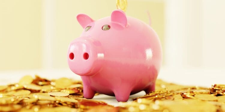 pink pig coin bank on brown wooden table