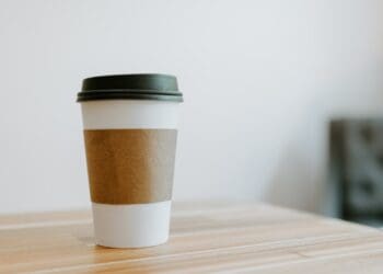 white and brown paper cup