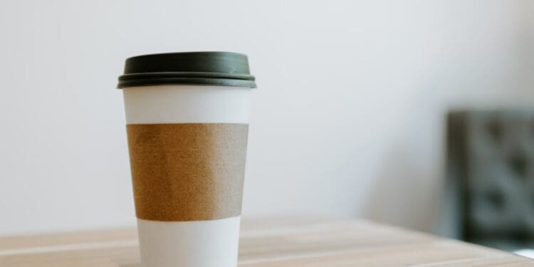 white and brown paper cup