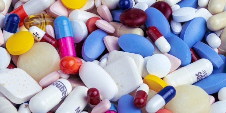white blue and orange medication pill