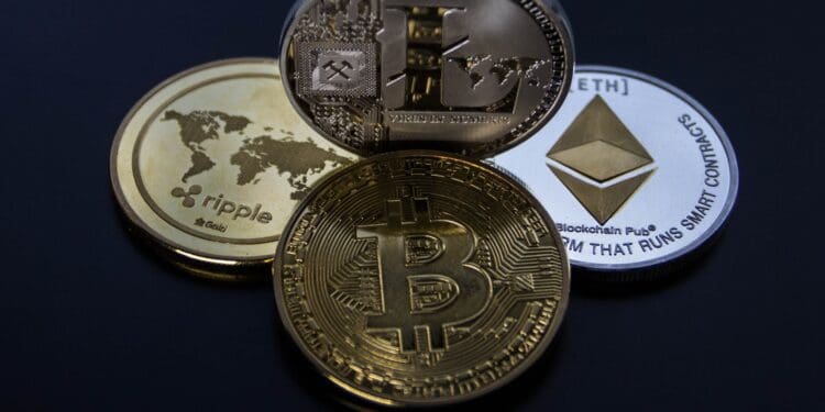 four assorted cryptocurrency coins