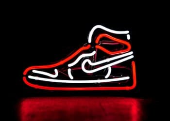 red and white Nike basketball shoe neon signage