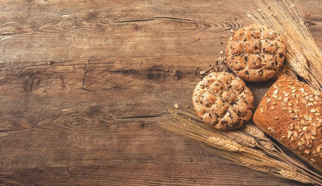 cookies, bread, and wheat on table