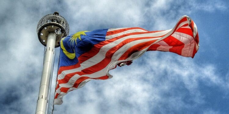 low angle photography of waving flag of Malaysia during daytime