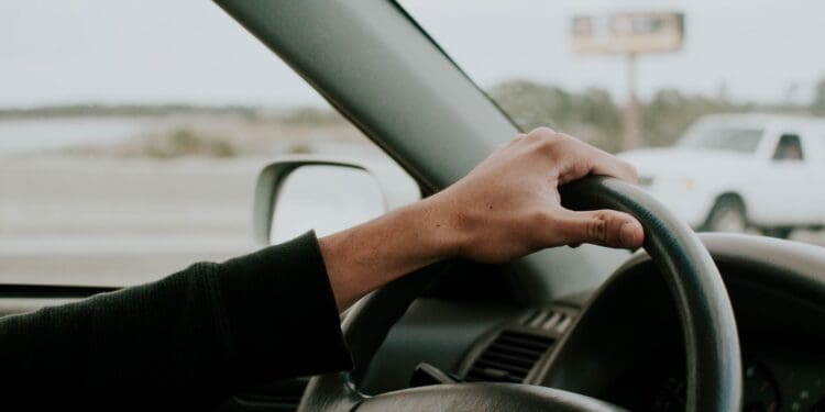 person driving Toyota car