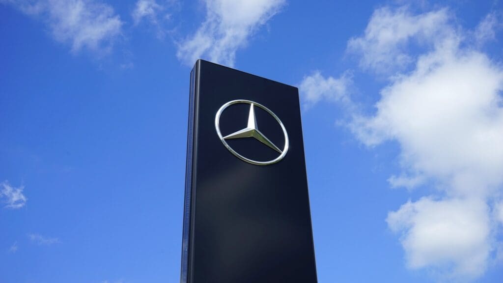 Black Mercedes-benz Building Under Blue and White Sky