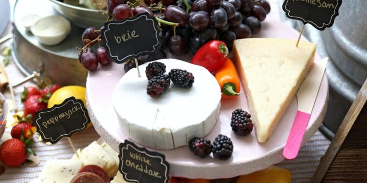 Sliced Cheese Served On White Tray