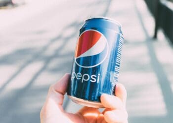 Person Holding Pepsi Can