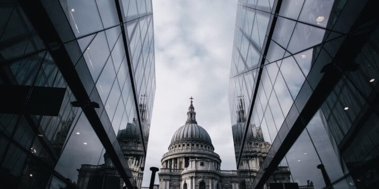 church between mirror-curtain buildings