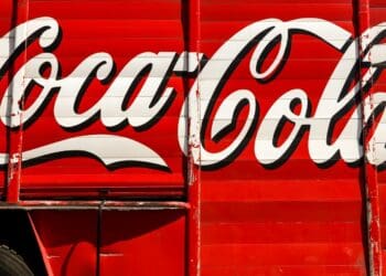 close-up photography of red and white Coca-Cola trailer
