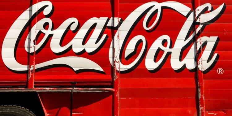 close-up photography of red and white Coca-Cola trailer