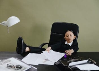 A Young Girl Sitting in the Office