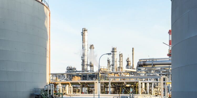 white and blue concrete building near body of water during daytime