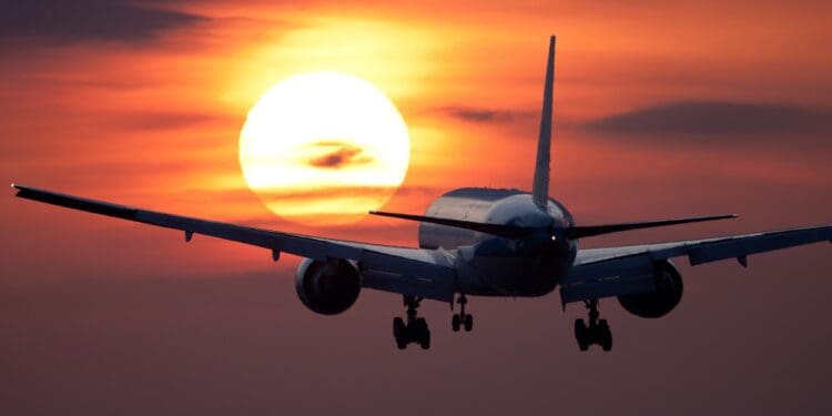 white plane flying during golden hour