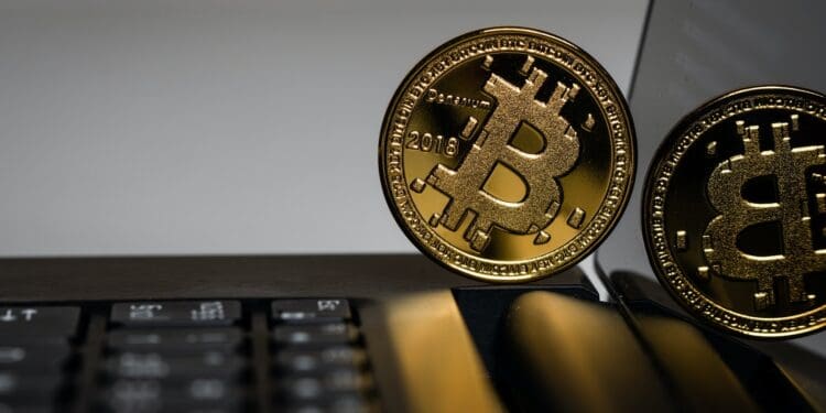 two gold Bitcoins