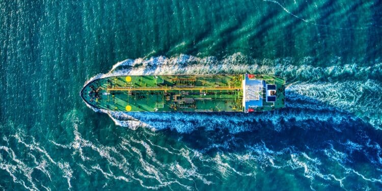 aerial view of white and yellow boat on body of water during daytime