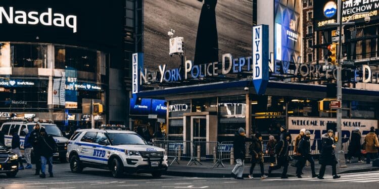 people walking on pedestrian lane near vehicles
