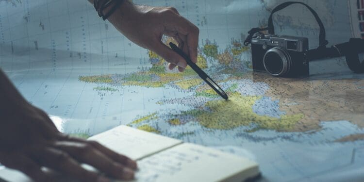 person writing on white paper