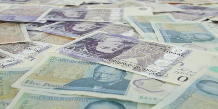 5 pieces of banknotes on yellow and white textile