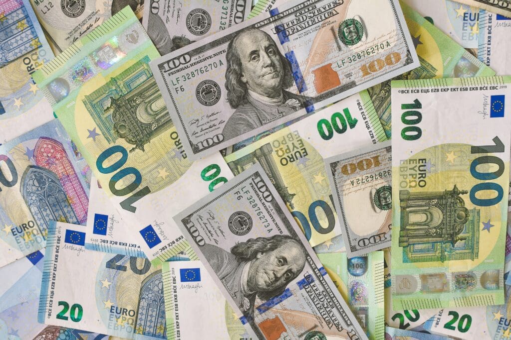 A pile of 20, 100 Euro <noread>(EUR)</noread>, and 20, 100 Dollar <noread>(USD)</noread> banknotes.