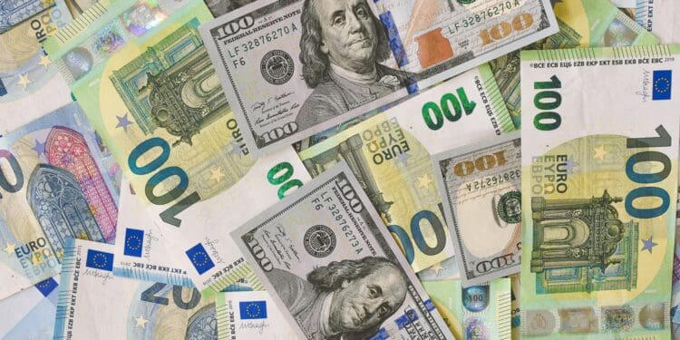 A pile of 20, 100 Euro (EUR), and 20, 100 Dollar (USD) banknotes.