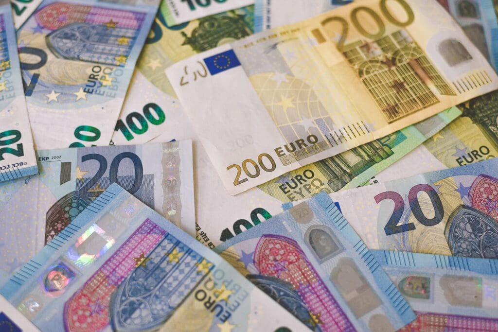 A pile of Euro <noread>(EUR)</noread> banknotes that include 20, 100, and 200 notes. <noread>(Part I)</noread>