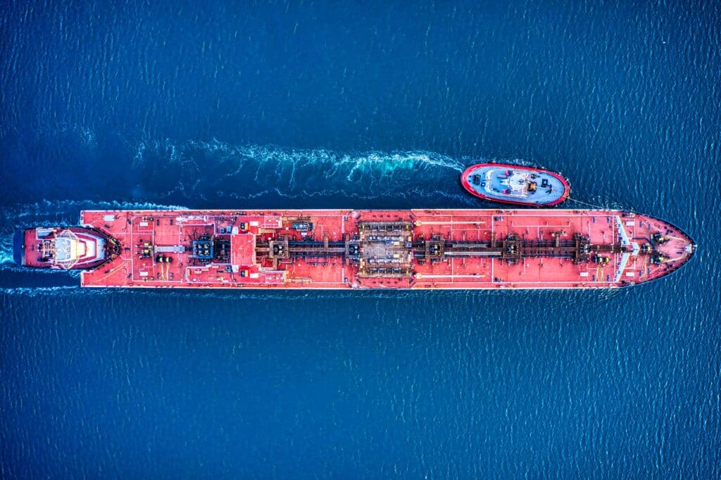 A red oil tanker shot from directly above.