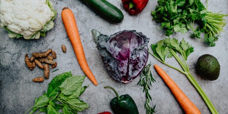 carrots and green vegetable on the ground