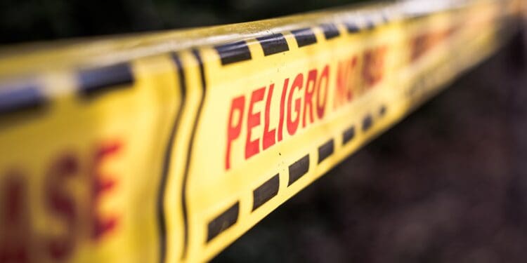 closeup photography of Peligro signage