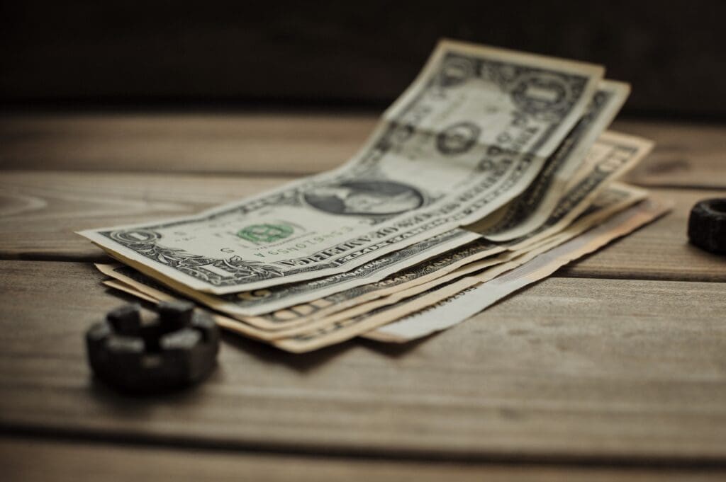dollars on a wooden background
