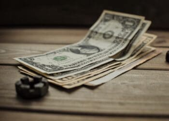 dollars on a wooden background